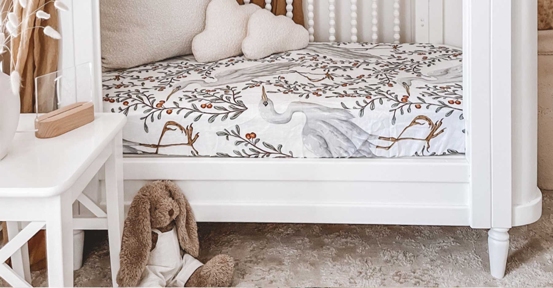 Cute baby room interior with crib and decor elements